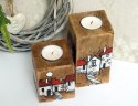 2 drewniane świeczniki z malowanymi domkami